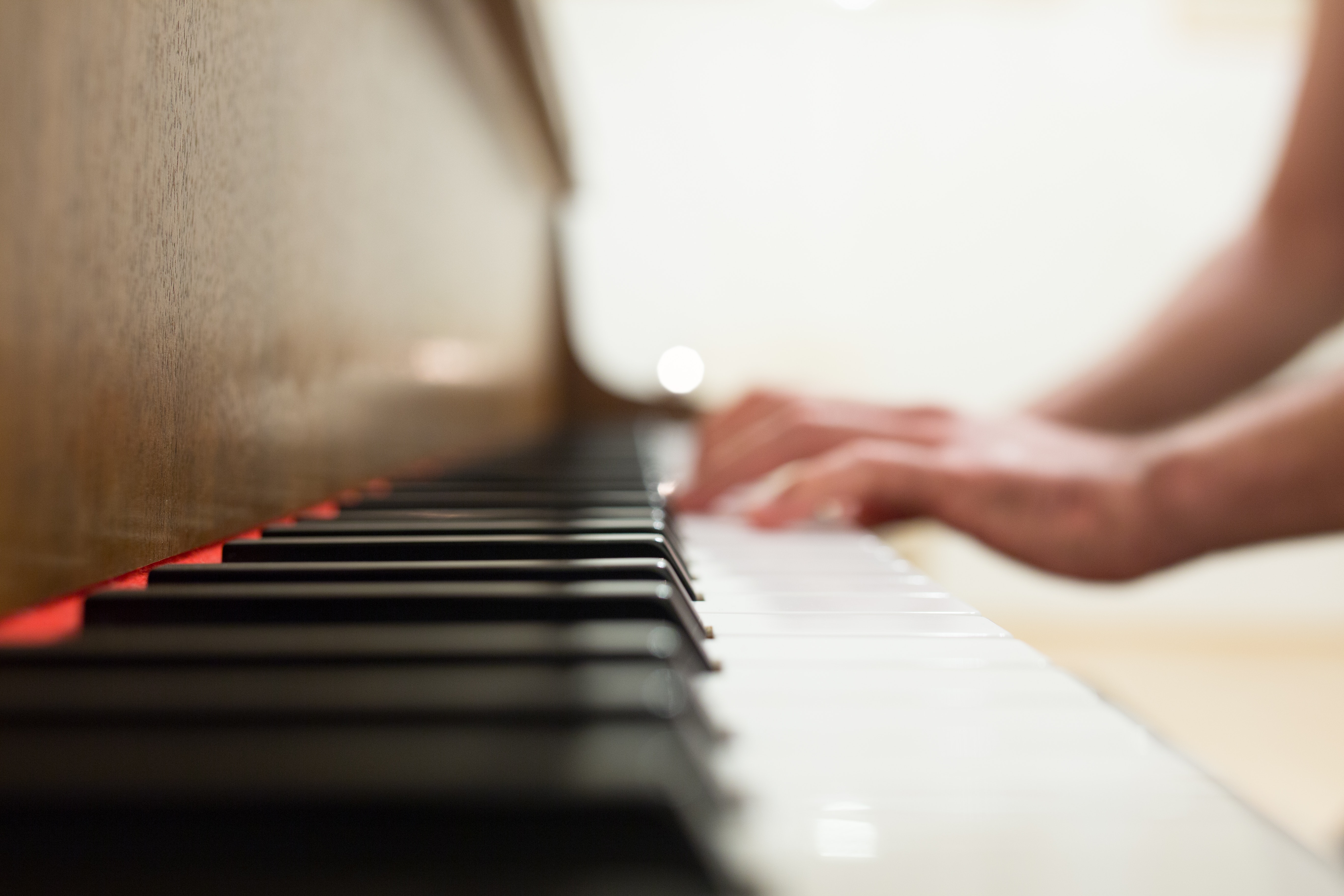 Person Playing Piano by Negative Space